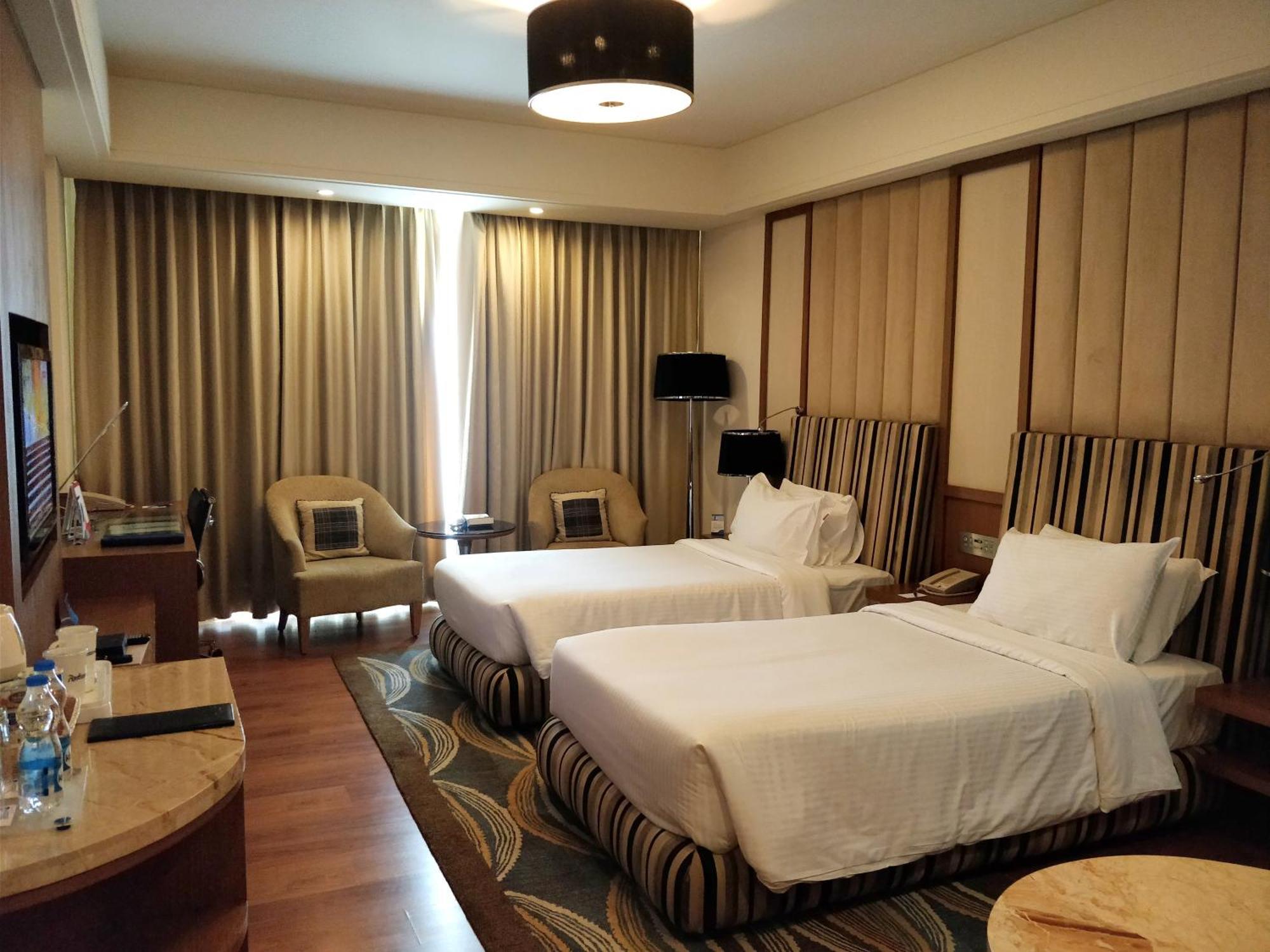 Deluxe Twin/King Room with Airport transfer and Complimentary 1+1 Happy Hours from 6pm to 8pm and 15% off on Food & Beverage Services , Laundry Services and Spa