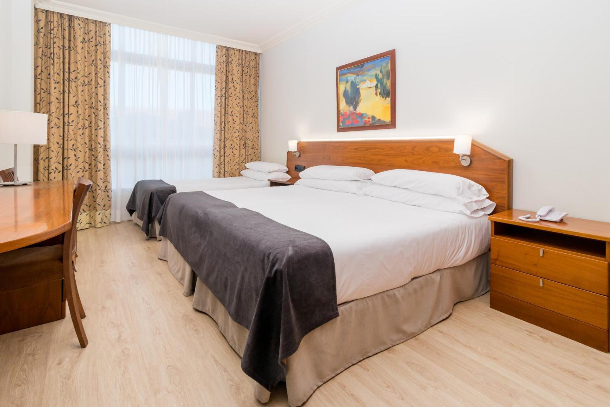 Habitación Doble con cama supletoria y acceso al spa