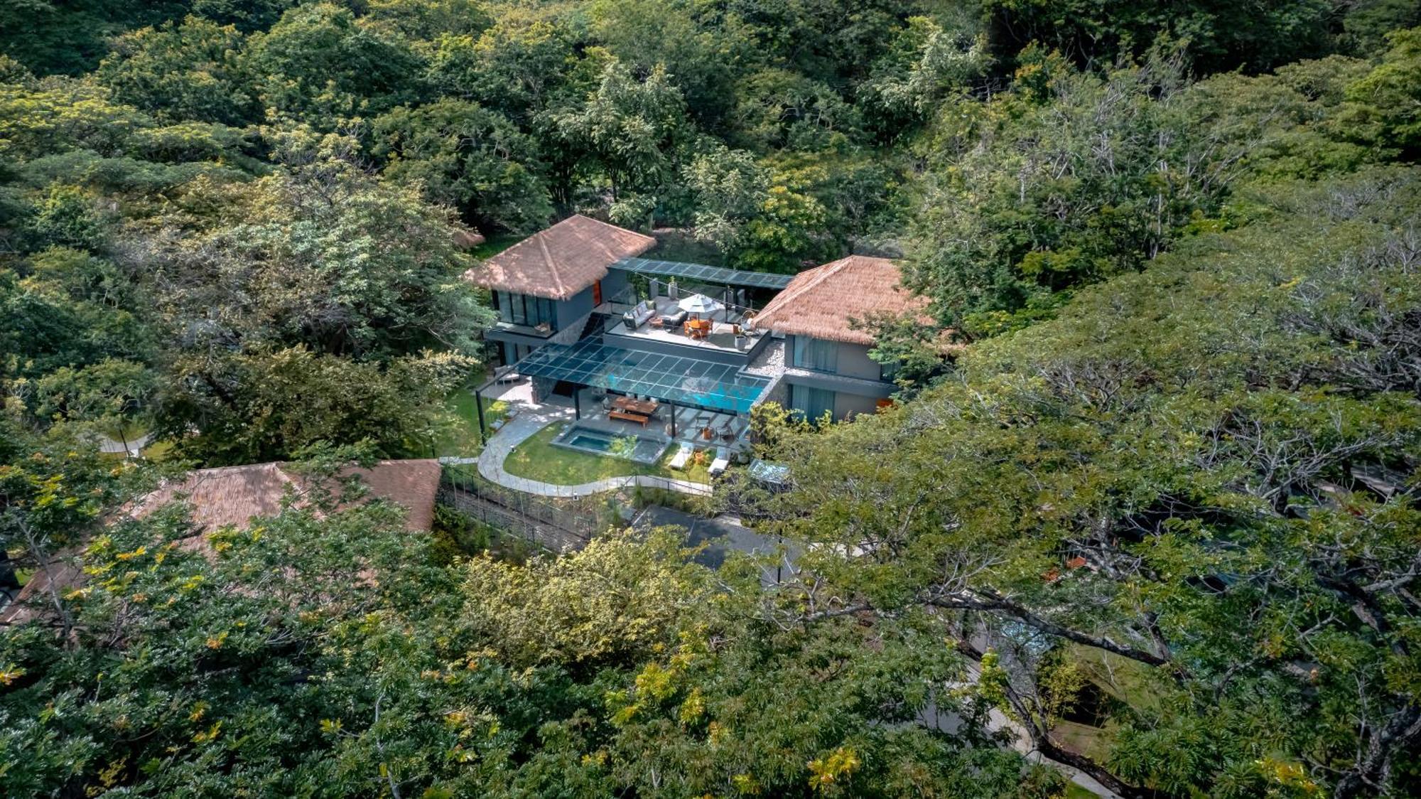 Four-Bedroom Villa with Balcony and Pool