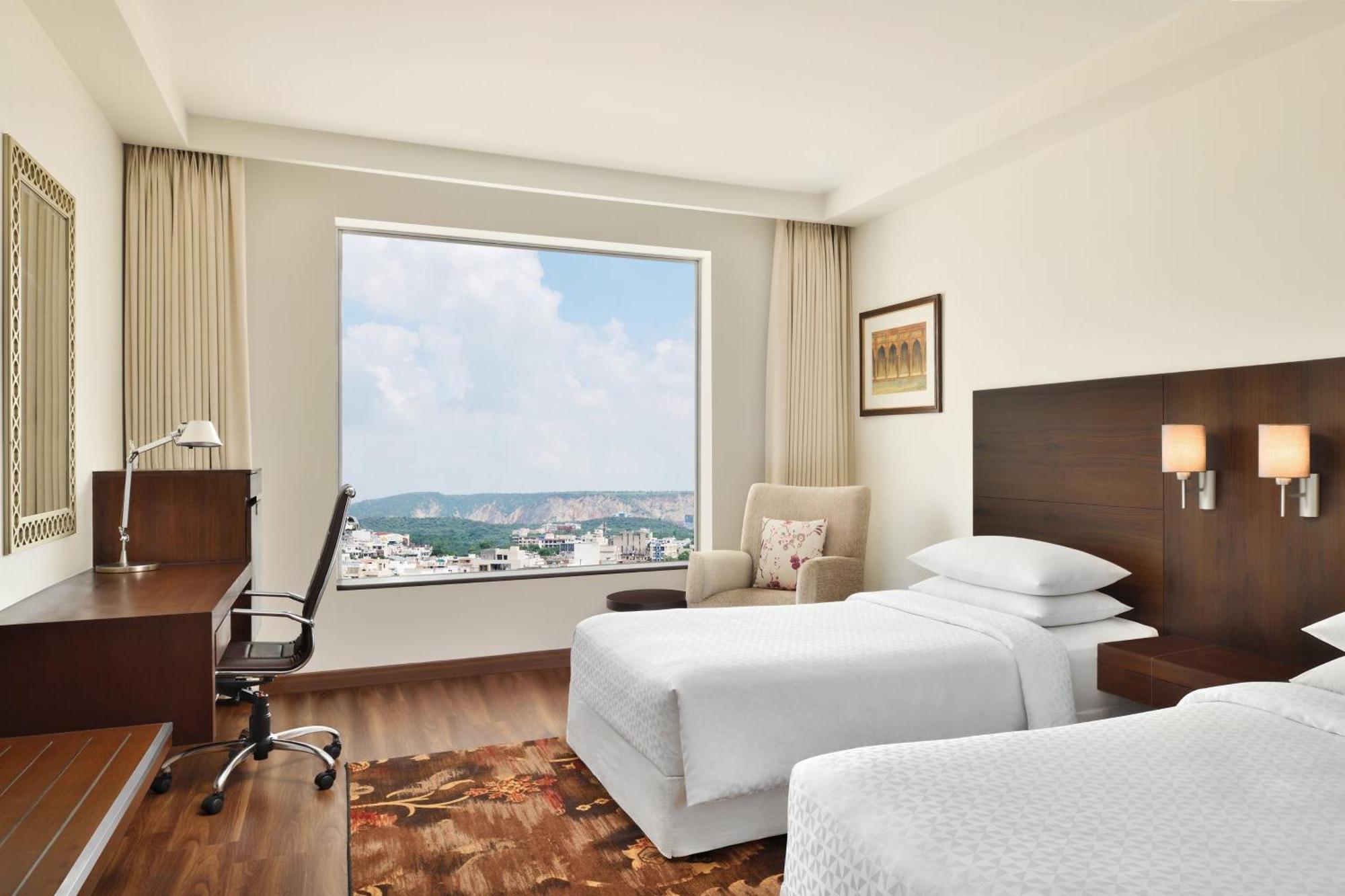 Deluxe Twin Room Dis on SPA Laundry Food & Soft Beverages only at The Eatery Credit Meal of INR 1000 or a the on bill amount of INR 2500 or