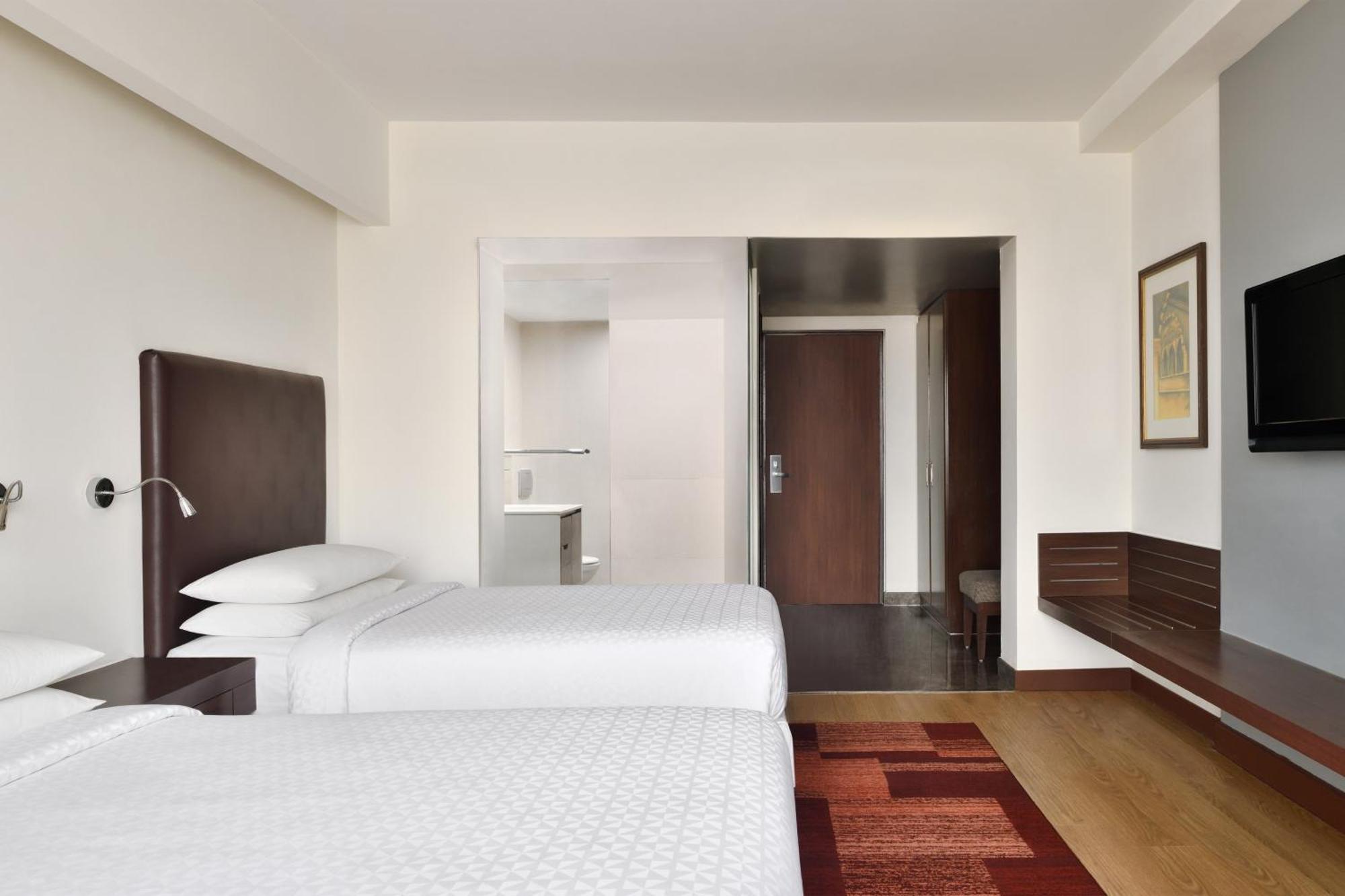 Deluxe Twin Room Dis on SPA Laundry Food & Soft Beverages only at The Eatery Credit Meal of INR 1000 or a the on bill amount of INR 2500 or