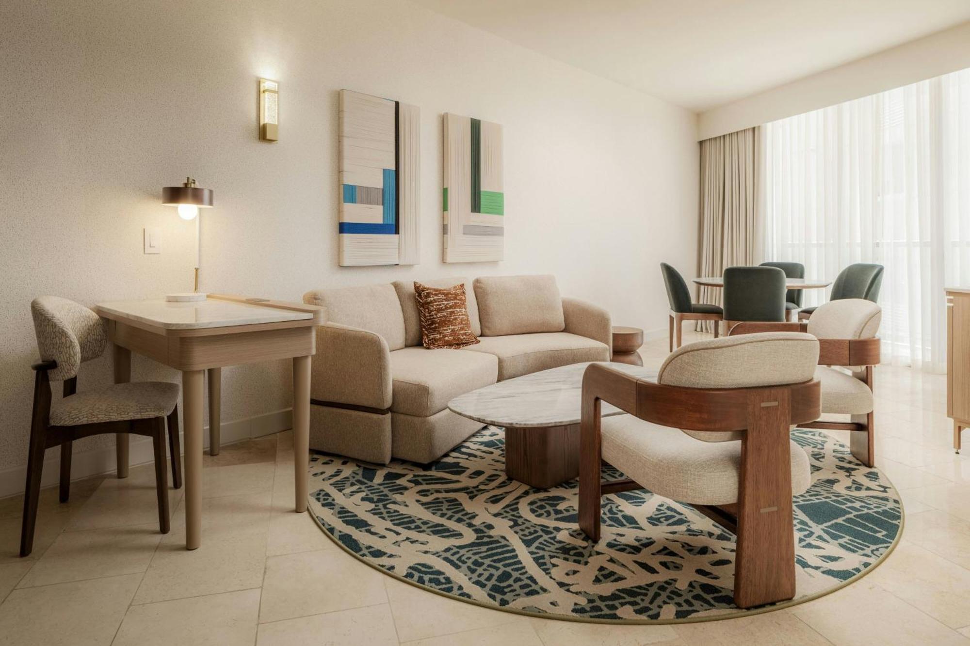 Executive suite with king bed, balcony and partial ocean view