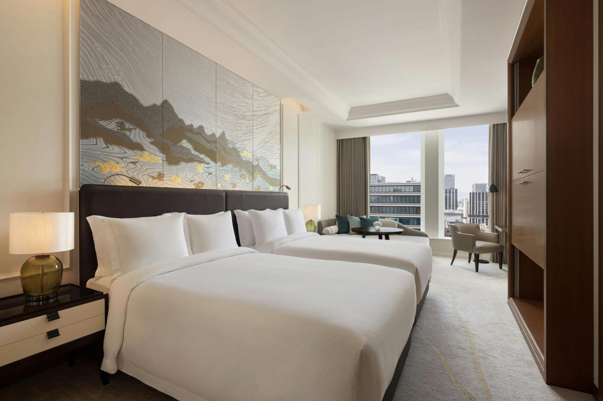 Large Grand Deluxe Room Two Double Beds City View