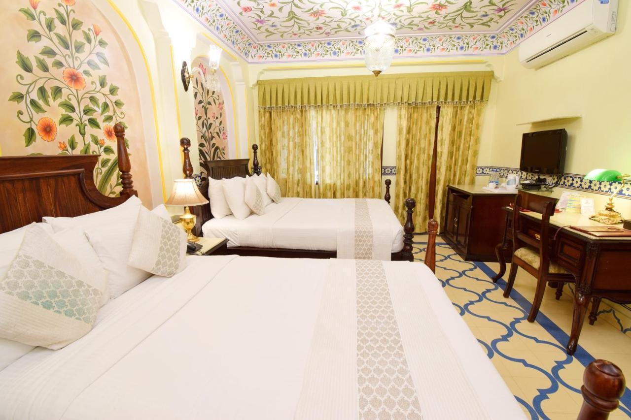Royal Suite Family pickup on arrival from train or bus station Enjoy a daily Rajasthani dance & music show from 7–9 PM swimming pool a dedicated travel desk to assist local sightseeing tours intercity travel arrangements & activiti
