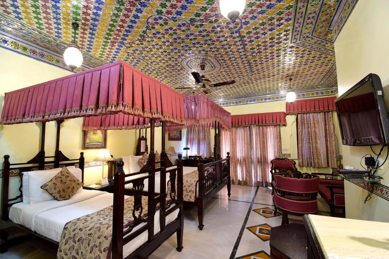 Royal Suite Family pickup on arrival from train or bus station Enjoy a daily Rajasthani dance & music show from 7–9 PM swimming pool a dedicated travel desk to assist local sightseeing tours intercity travel arrangements & activiti