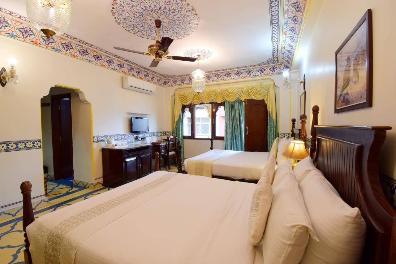 Royal Suite Family pickup on arrival from train or bus station Enjoy a daily Rajasthani dance & music show from 7–9 PM swimming pool a dedicated travel desk to assist local sightseeing tours intercity travel arrangements & activiti